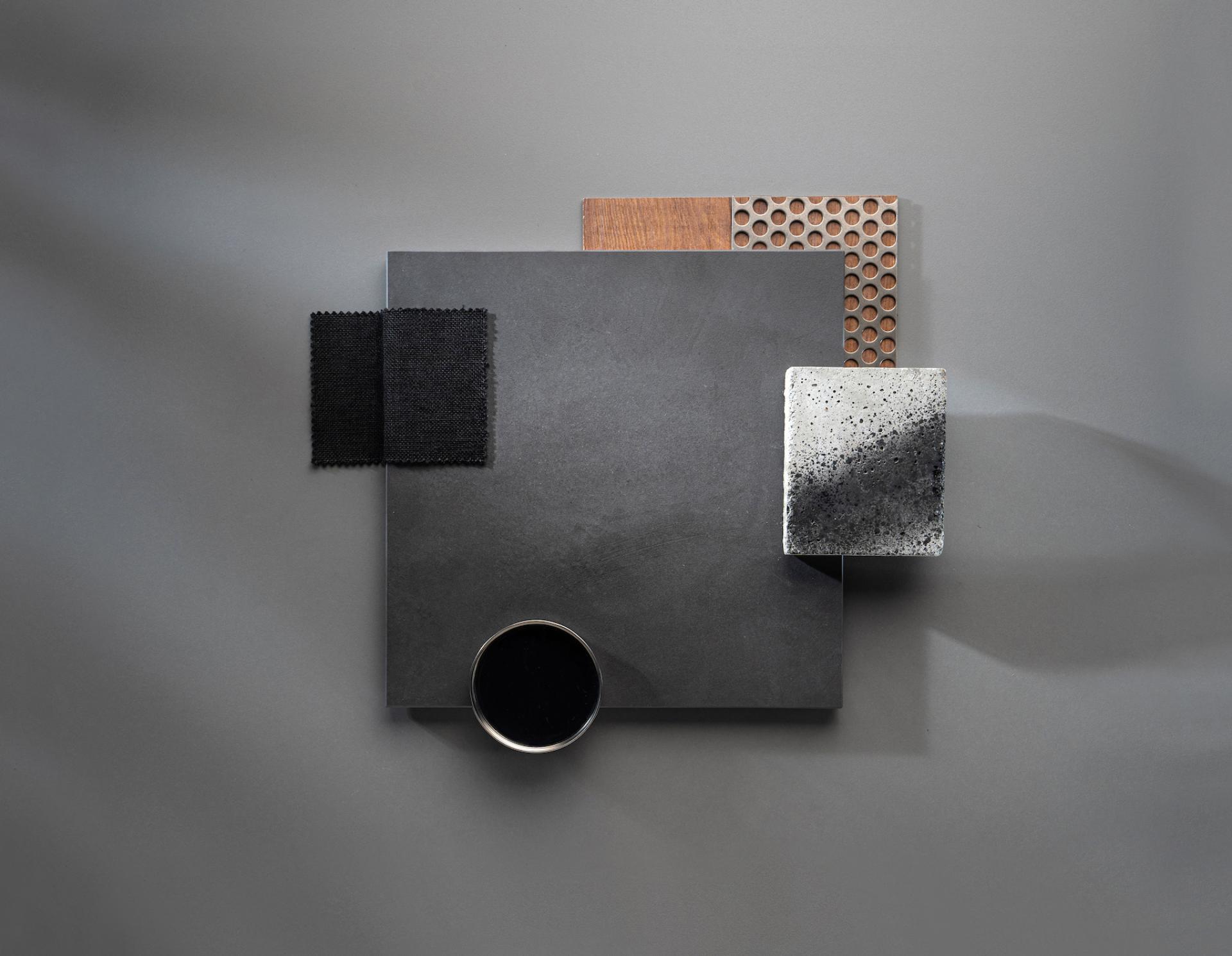 Dekton® samples showcasing Onirika and Kraftizen textures, including stone, wood, and fabric elements on a sleek background.