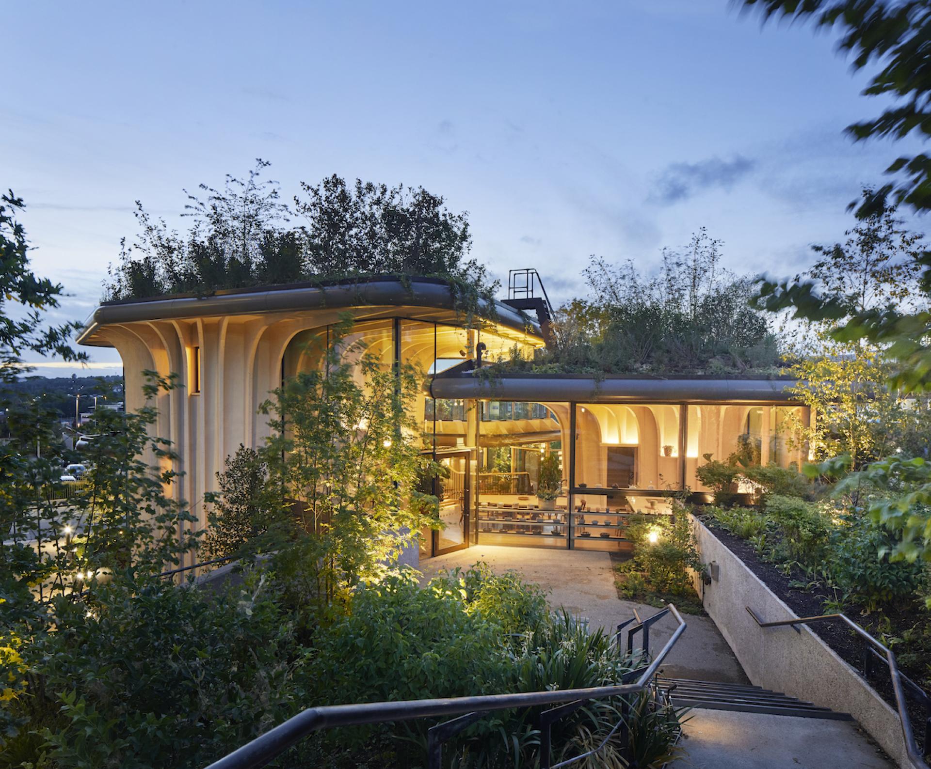 Maggie's Leeds, designed by Heatherwick Studio, showcases organic architecture with greenery integrated into the structure.