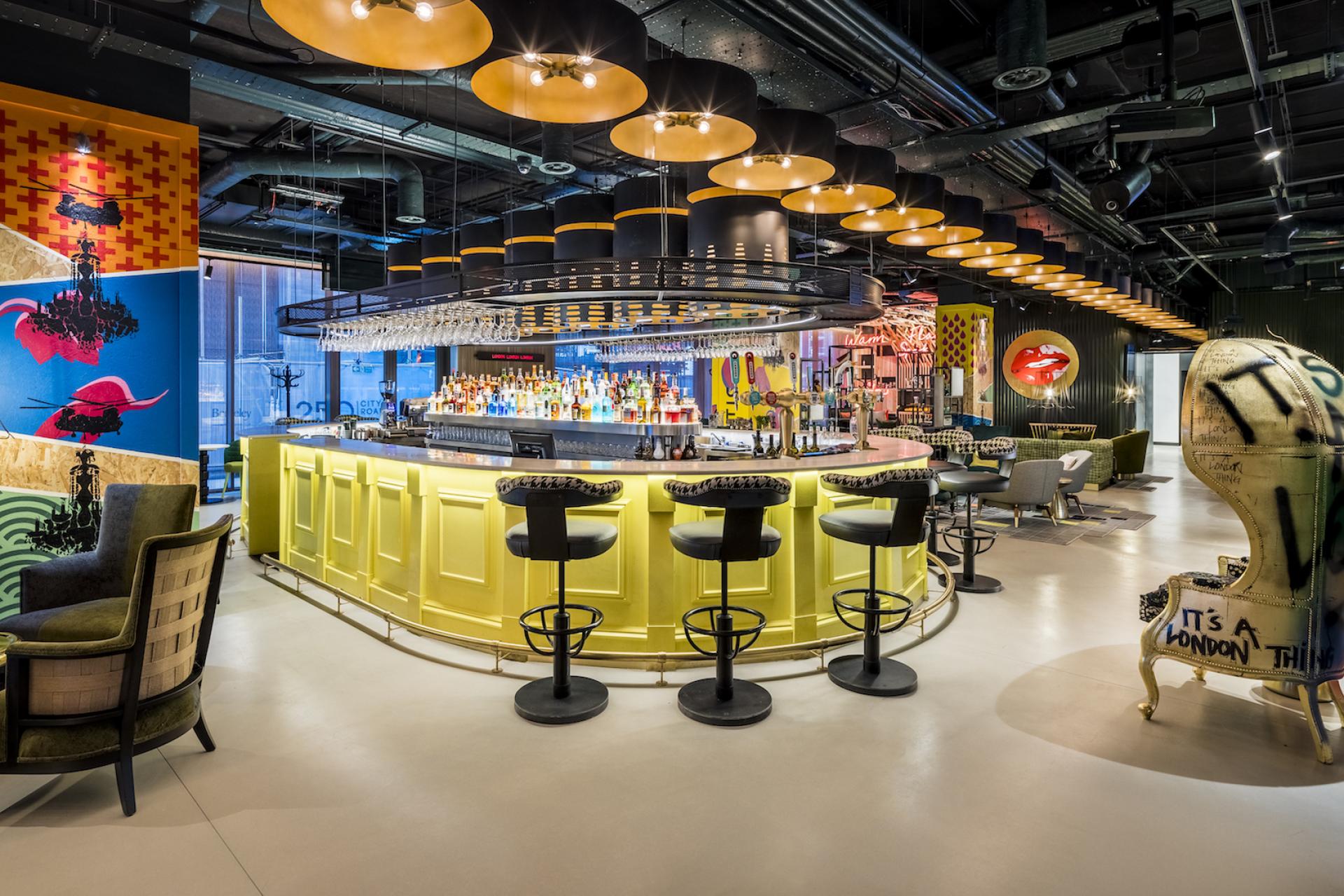 Vibrant bar area at nhow London, featuring colorful decor and a unique design representing London's cultural icons.