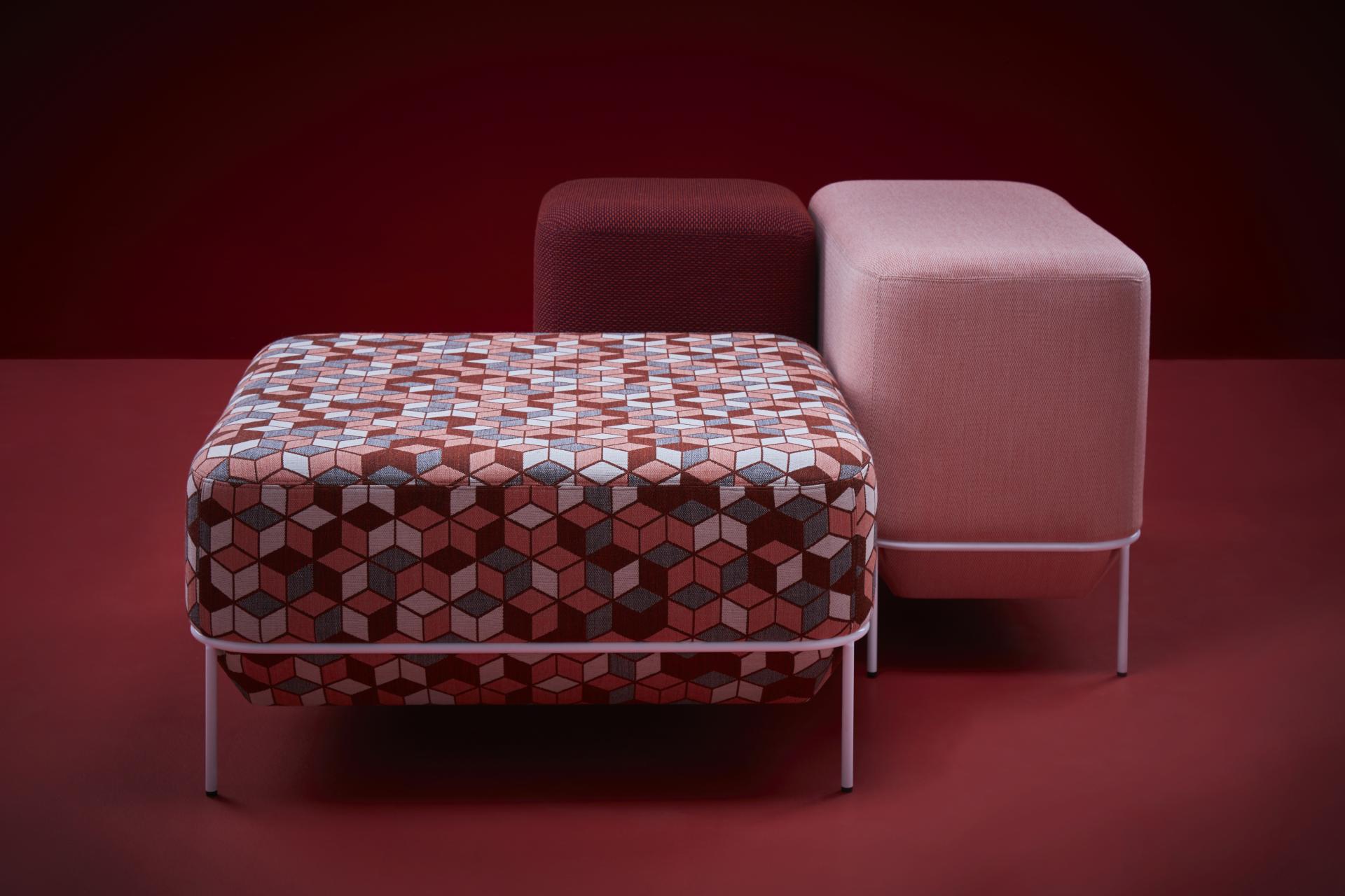 Stylish multi-colored ottomans showcasing modern design, comfortable textures, and geometric patterns, ideal for contemporary interiors.