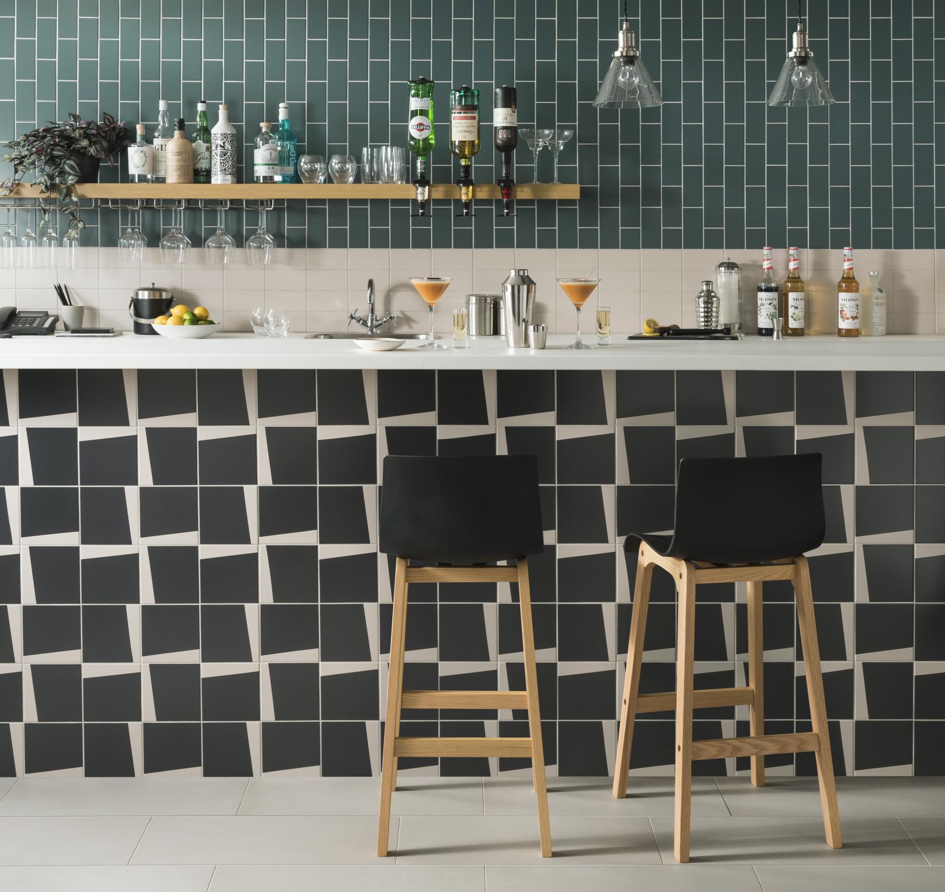 Contemporary kitchen featuring Tom Pigeon tiles, a stylish bar area, and modern decor elements.