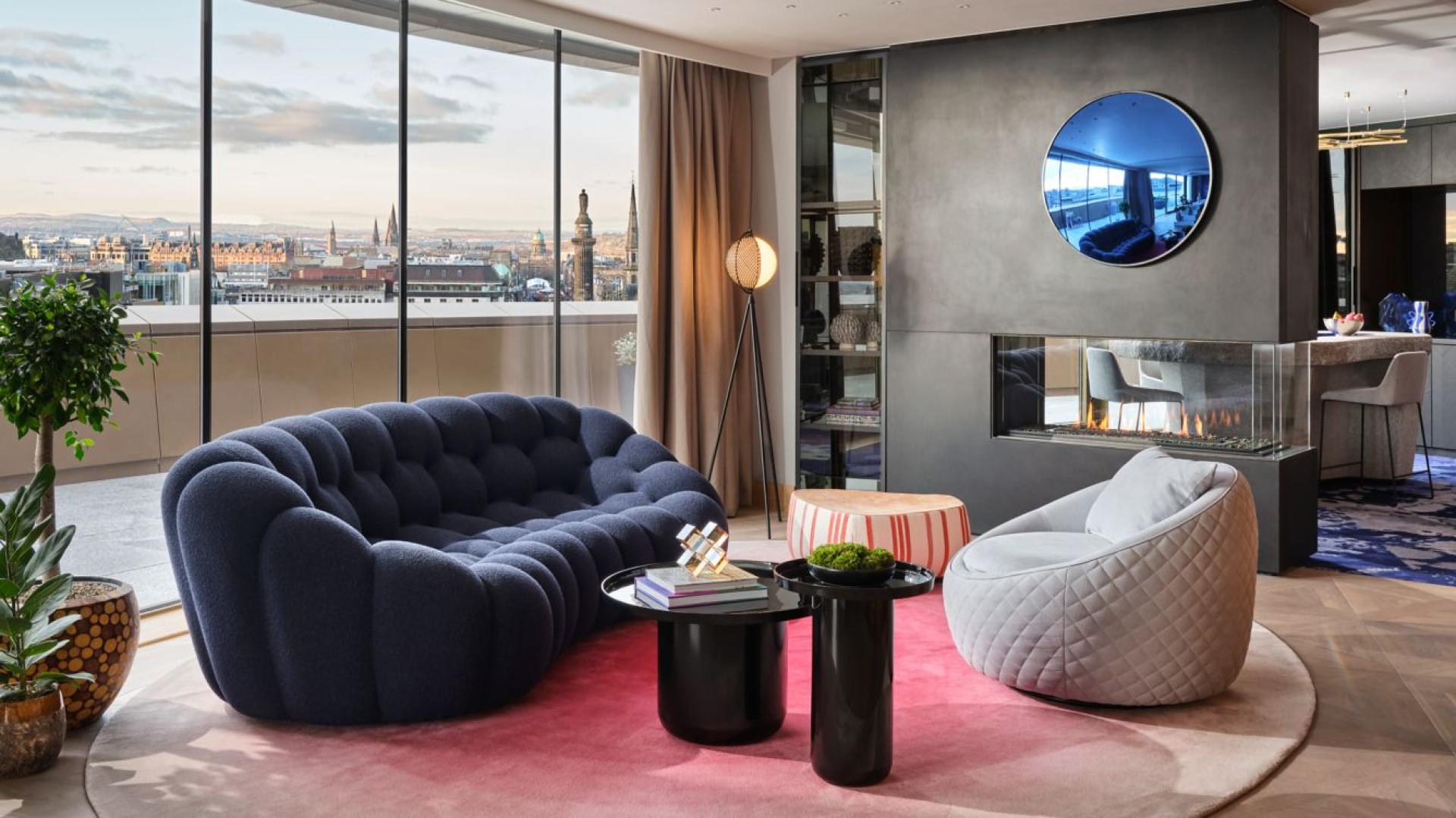 Stylish lounge area at W Hotel Edinburgh featuring modern furniture, vibrant decor, and panoramic city views.