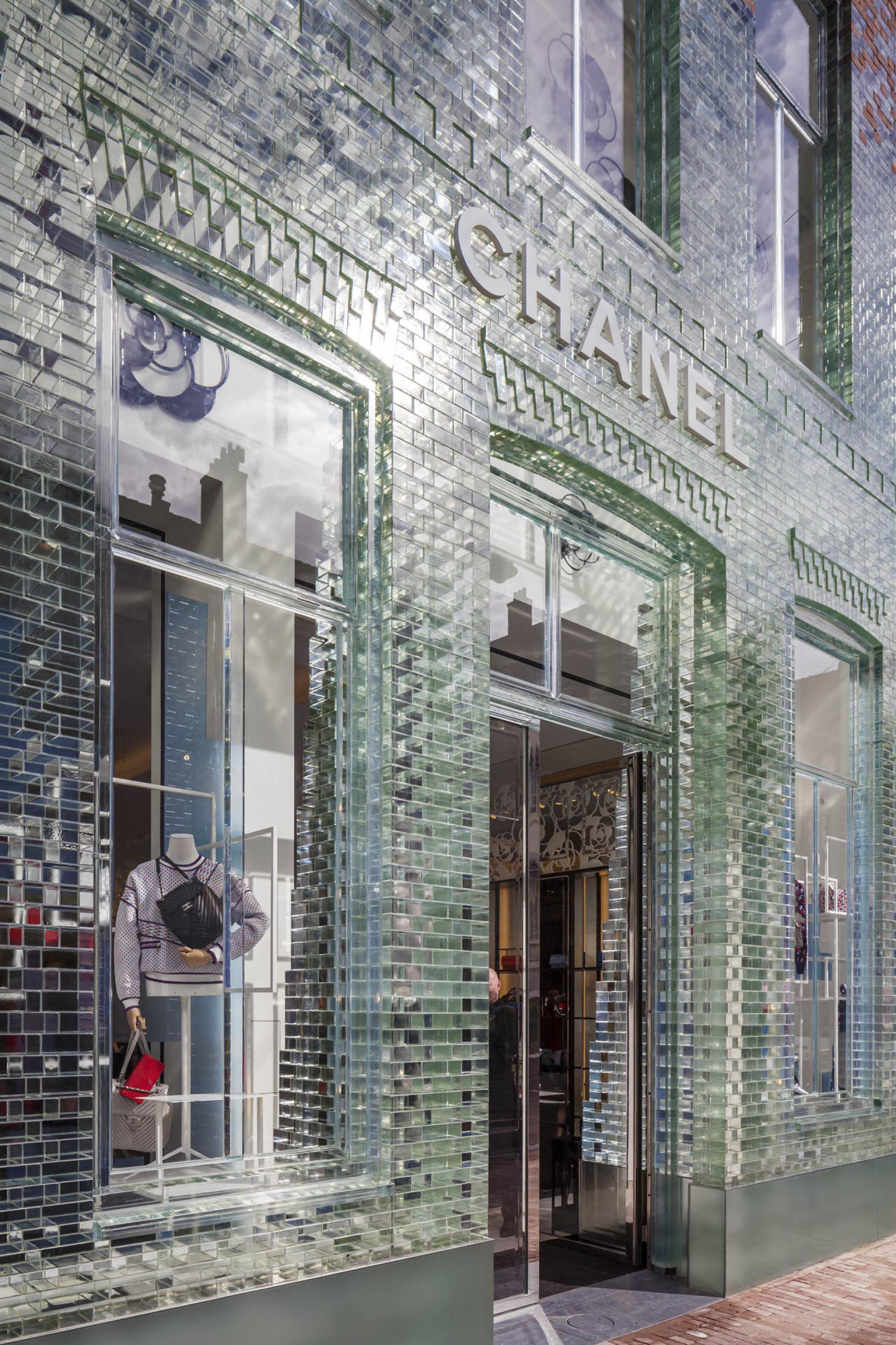 Chanel store entrance featuring a stunning glass façade, part of MVRDV's Crystal Houses in Amsterdam.