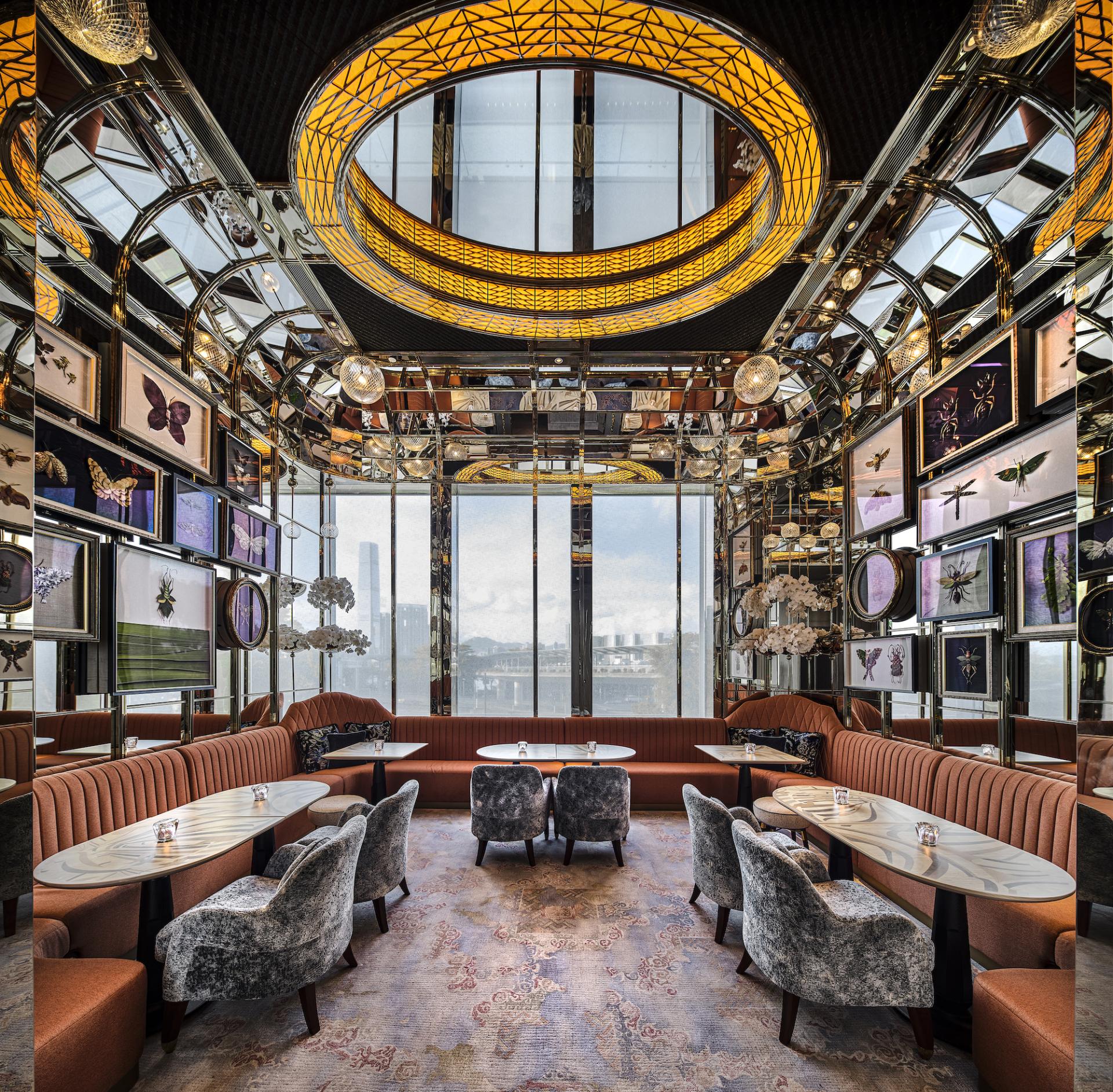 Elegant interior of Argo cocktail bar at Four Seasons Hong Kong, featuring unique decor and stunning city views.
