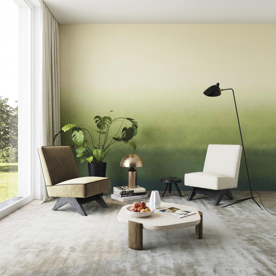 Stylish living room featuring Omexo's sustainable wallcovering with a gradient green design, modern furniture, and decorative plants.