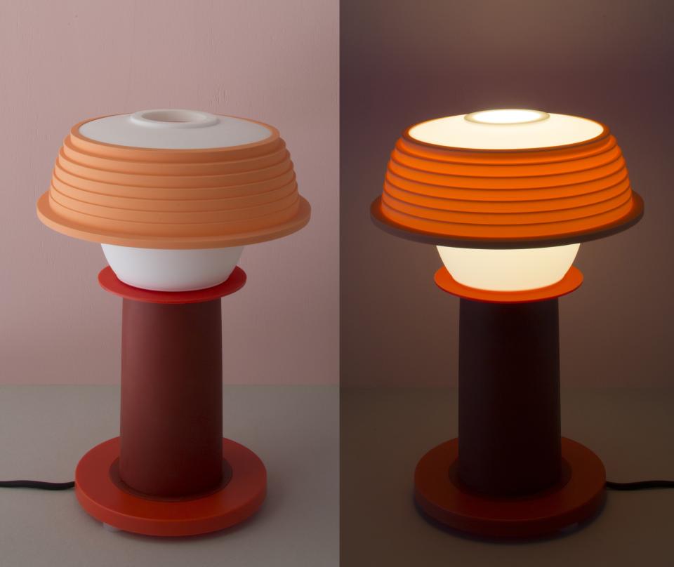 SowdenLight SHADES collection features a stylish lamp with unique design and customizable color options, illuminated softly.