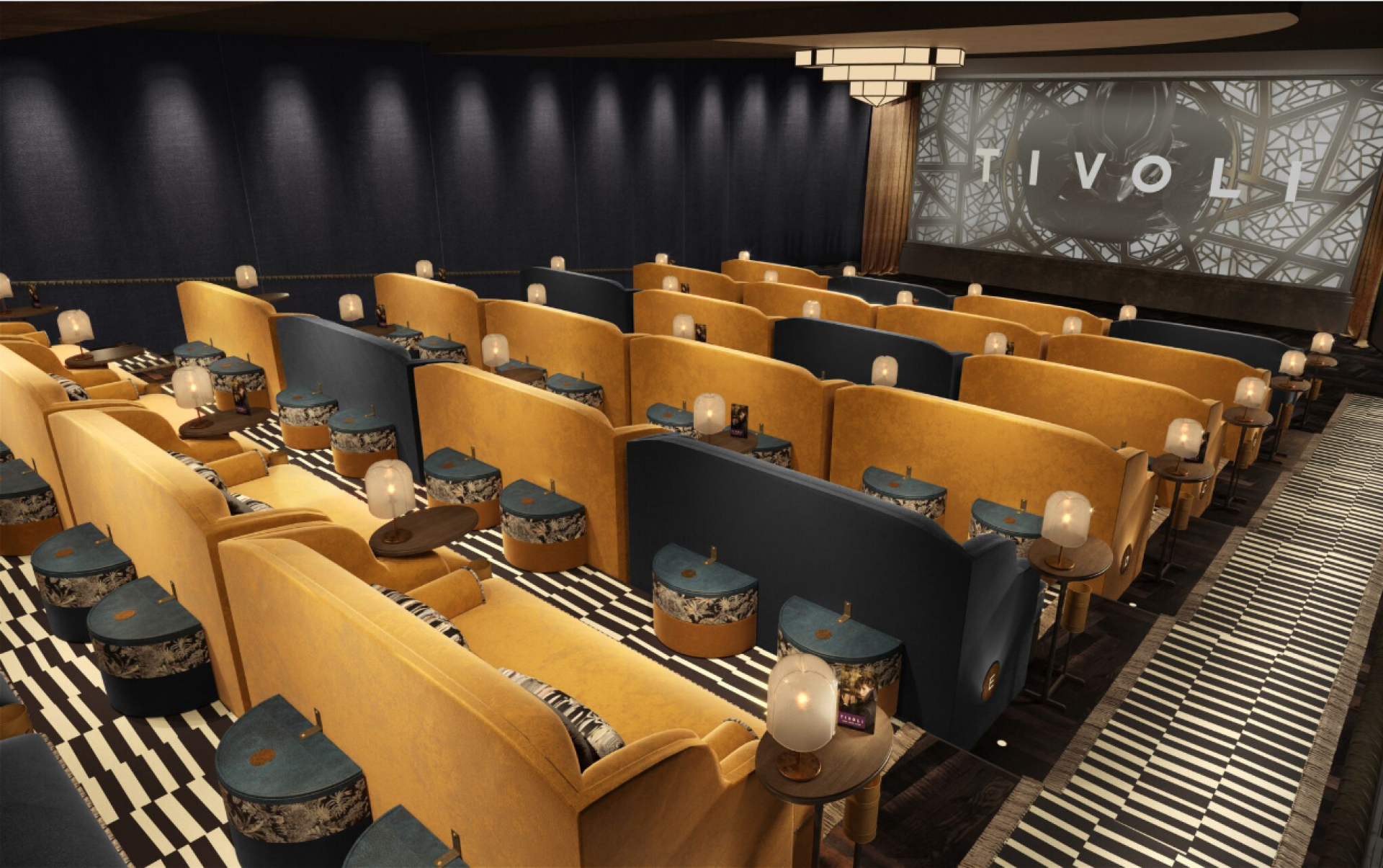 Boutique cinema TIVOLI's stylish interior features plush seating, unique tables, and an elegant ambiance for arthouse films.