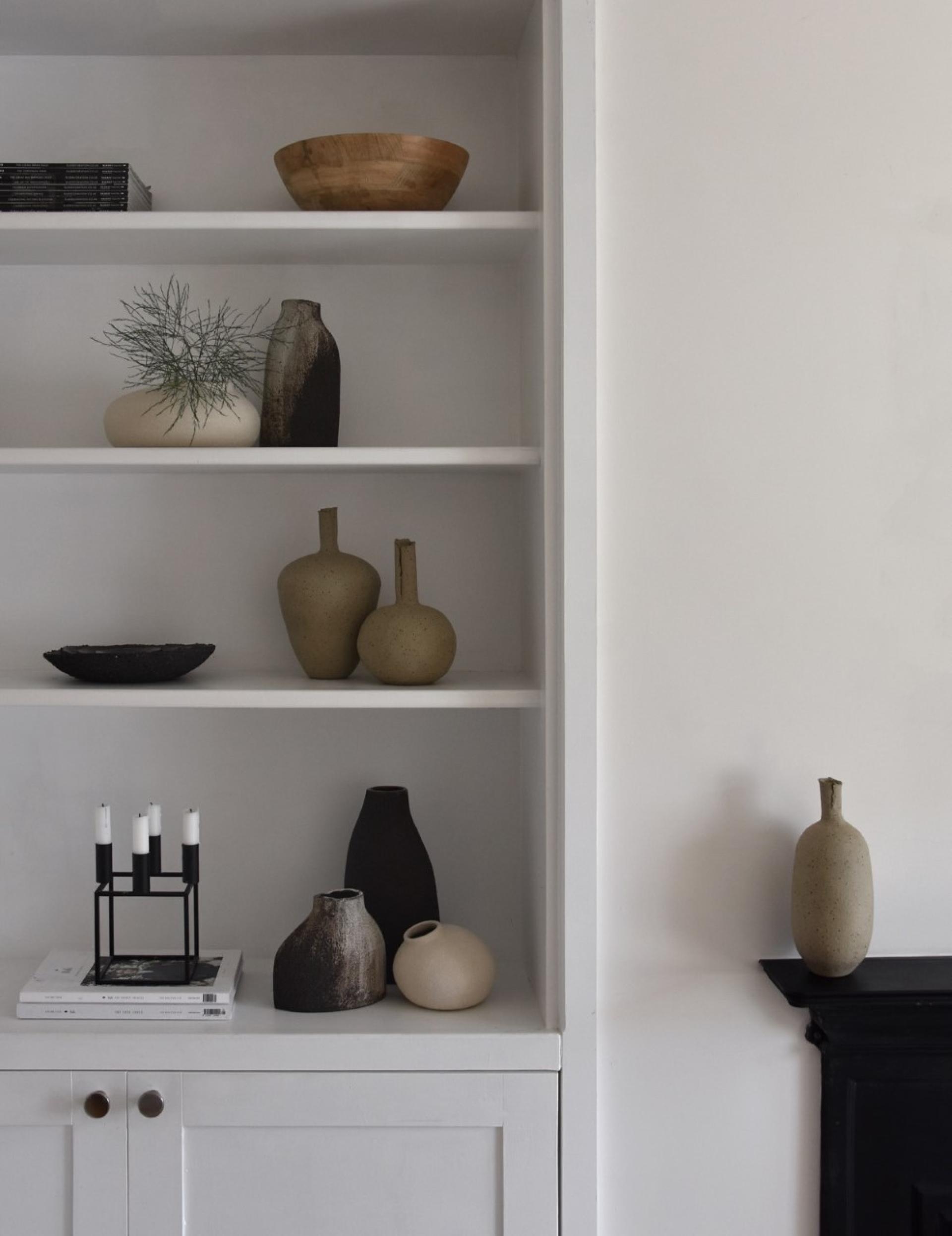 Stylish display of modern ceramic vases and wooden bowls highlighting Bristol's creative craft scene.