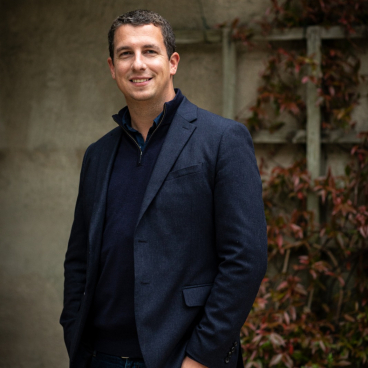 Peter Sproule, design director at Moda Living, poses confidently outdoors, reflecting on the evolving rental market and sustainability.