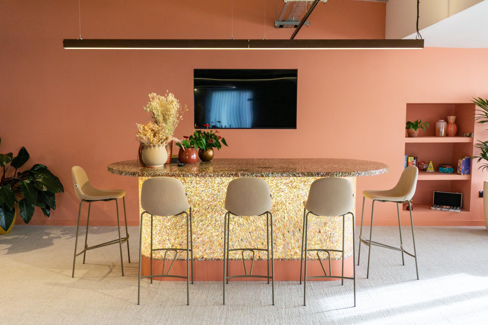 Modern bar area in Crown Paints' Liz Hickson Academy, featuring stylish seating and vibrant decor promoting collaboration and wellbeing.