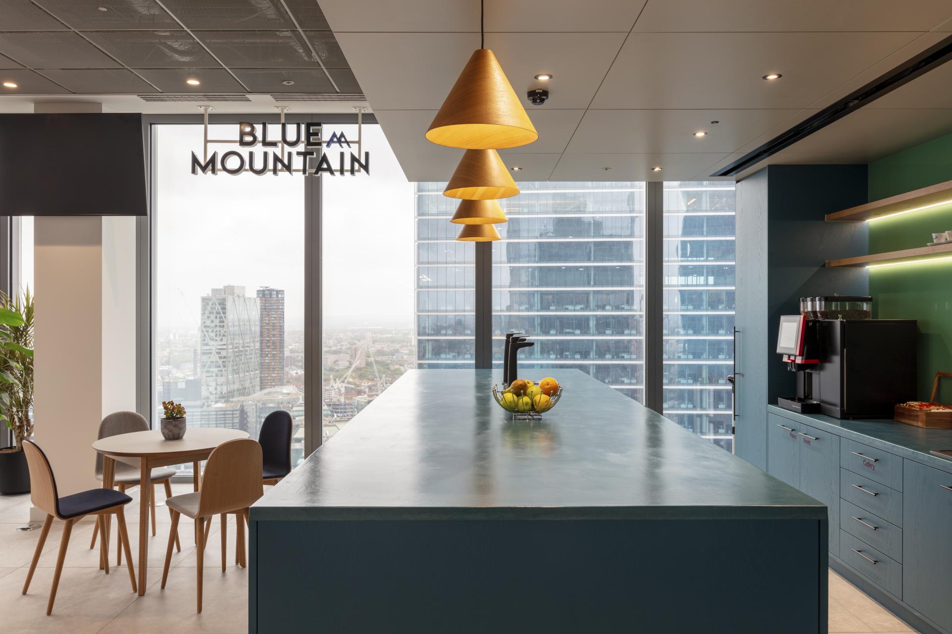 Modern office kitchen at Canopius' 22 Bishopsgate location, featuring sleek design and skyline views.