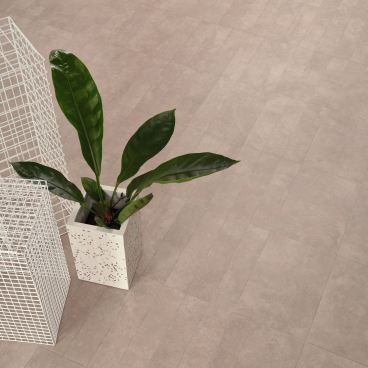 Biophilic design featuring potted plant and modern wire planters on bio-attributed luxury vinyl tile flooring.