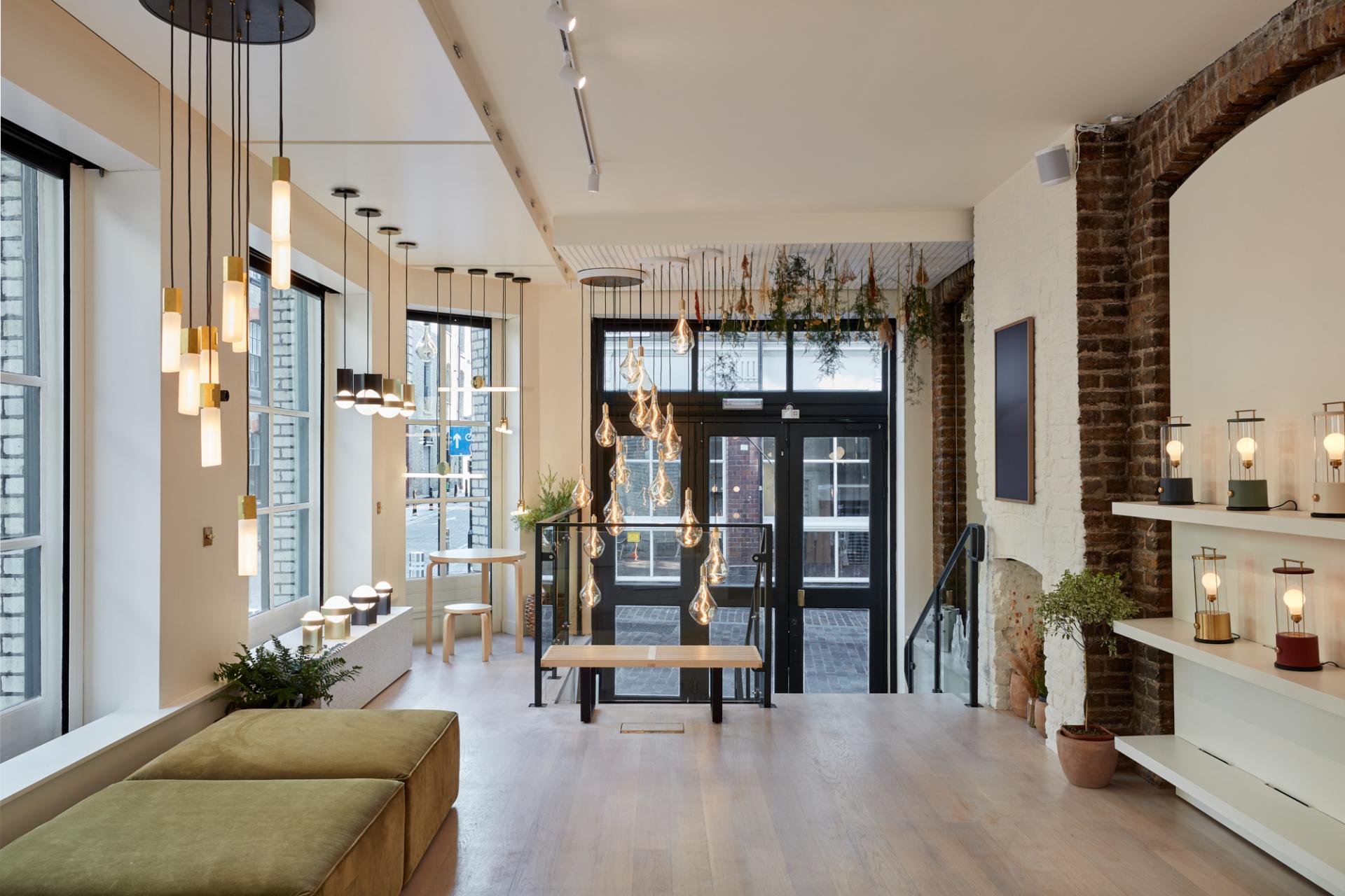 Modern Shoreditch showroom featuring sustainable lighting designs by Tala, with elegant fixtures and natural decor elements.