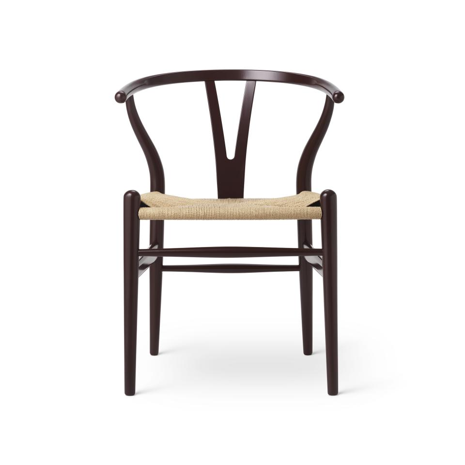 Wishbone chair by Carl Hansen & Son, featuring a classic design with a dark wood frame and natural fiber seat.