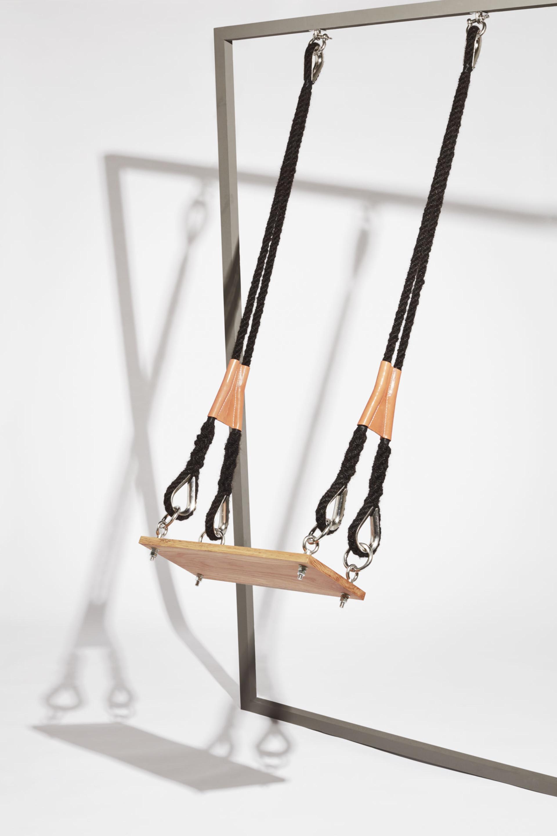 Sustainable outdoor swing made from biomaterials, featuring rope and wood, highlighting low carbon design innovations for 2025.