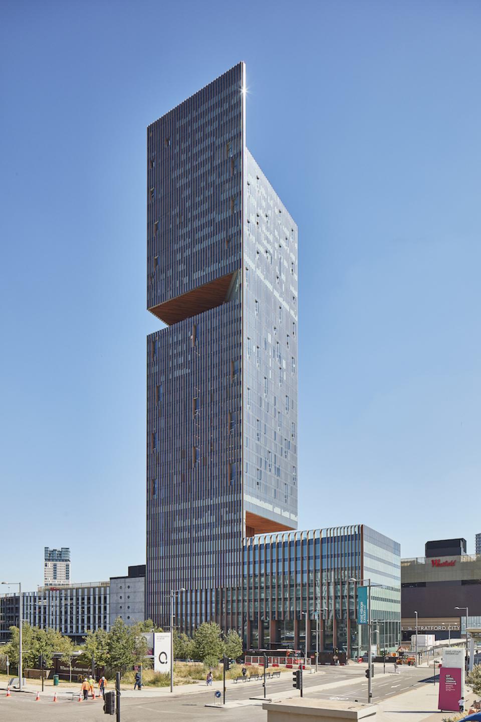 Modern architectural design of The Stratford showcasing its unique structure and integration within Stratford City, emphasizing hospitality and culture.