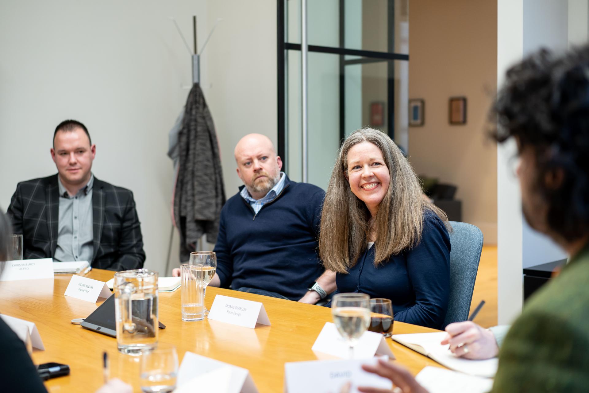 Participants engage in a discussion at a sustainability seminar, highlighting collaboration in addressing the climate crisis.