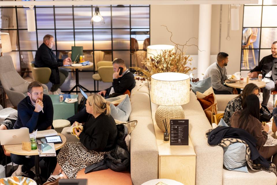 Visitors engage in discussions and networking at Material Source Studio’s lounge during the Community 2024 celebration event.