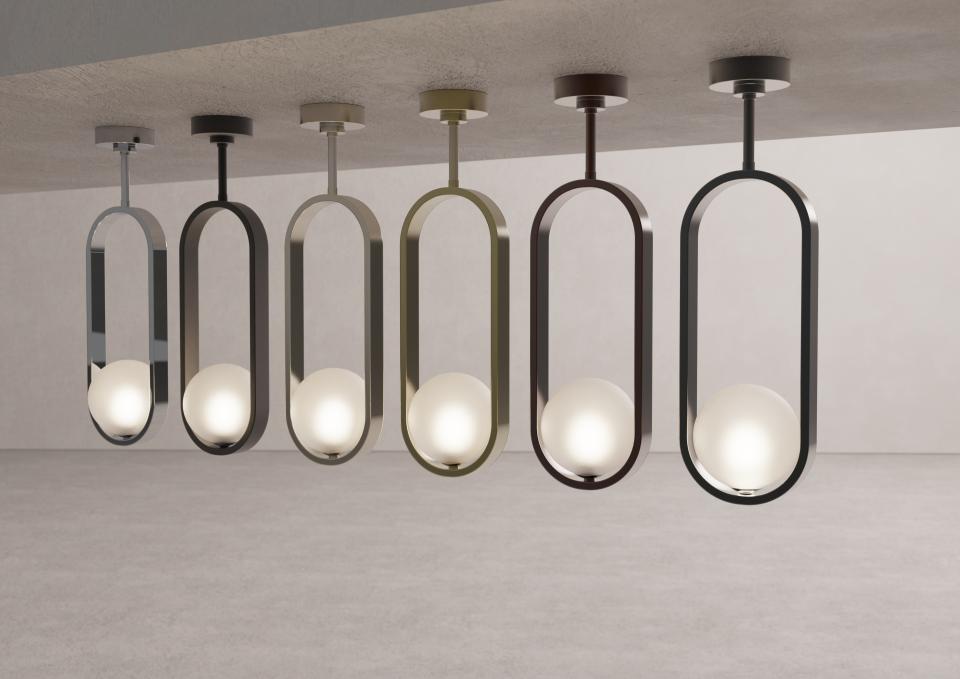 Sleek pendant lights from Crosswater's Tranquil Lights collection featuring rounded bulbs and modern finishes, enhancing brassware designs.