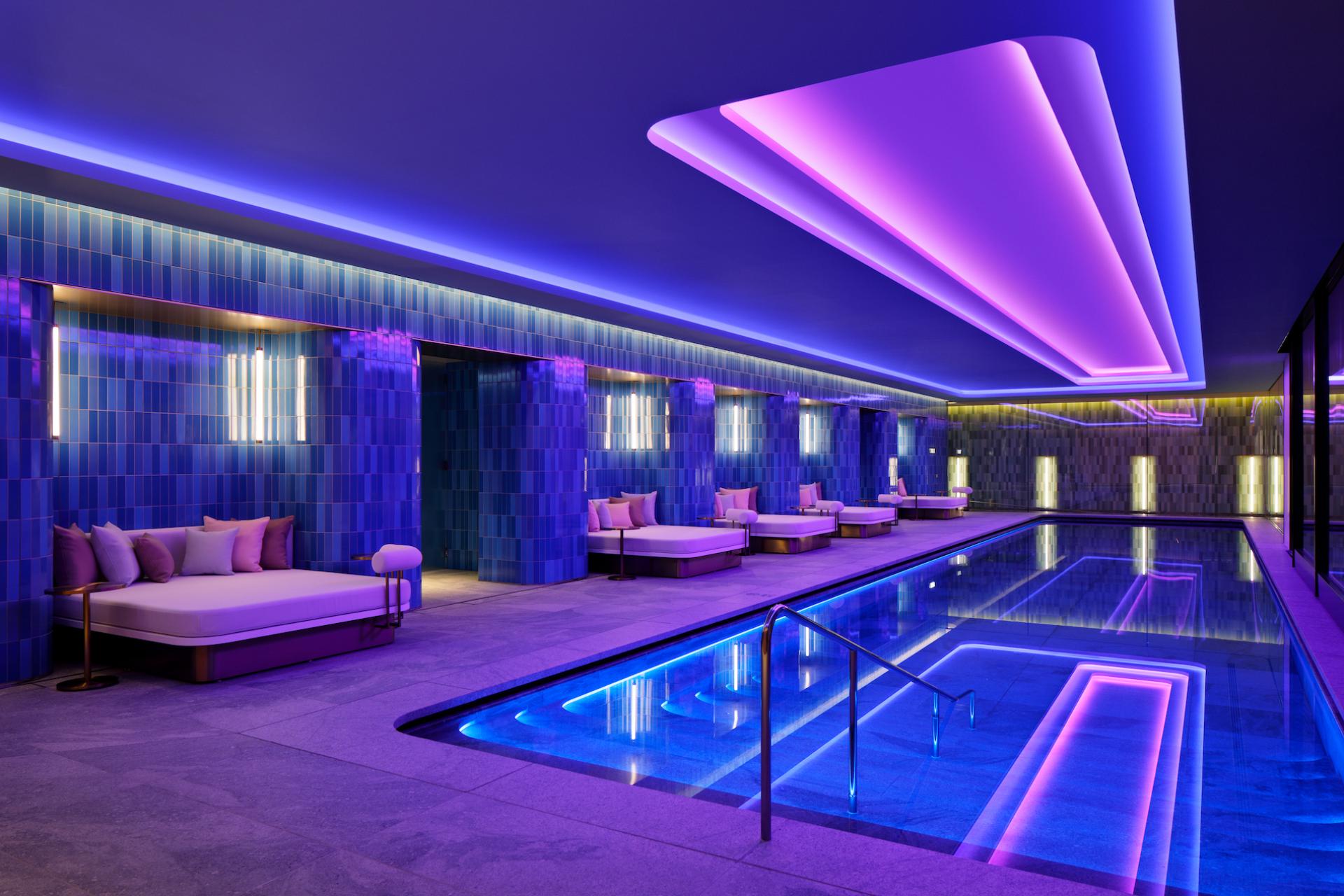 Luxurious indoor pool area at W Osaka, featuring modern design elements and vibrant lighting for a relaxing atmosphere.