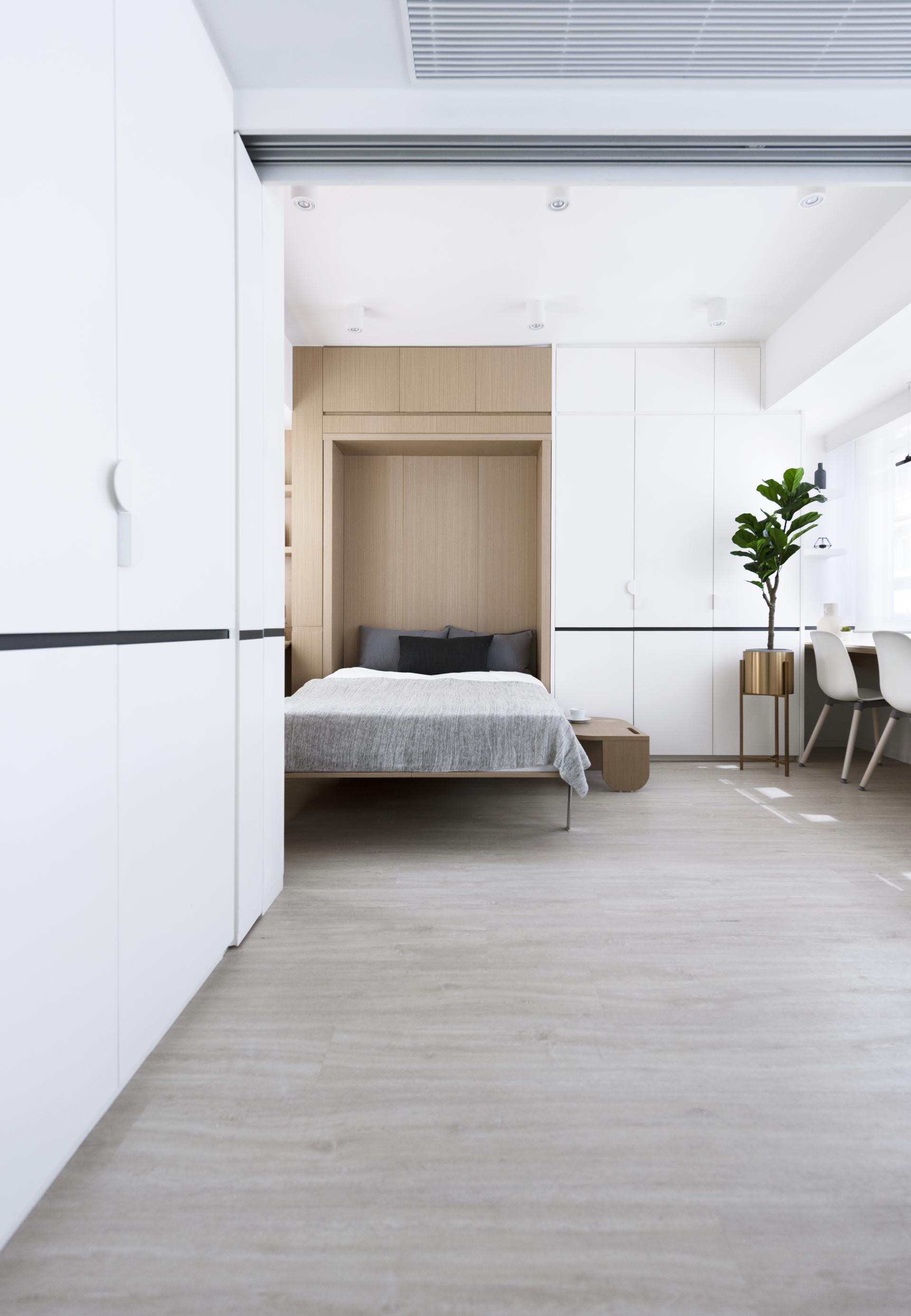 Contemporary Live+Work space featuring a stylish bedroom area with modern furnishings and natural light.