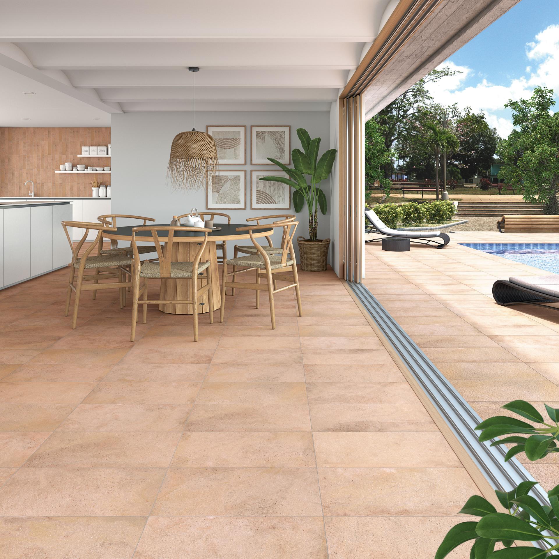 Modern dining area featuring ceramic tiles with a seamless indoor-outdoor transition, highlighting natural aesthetics and design trends.