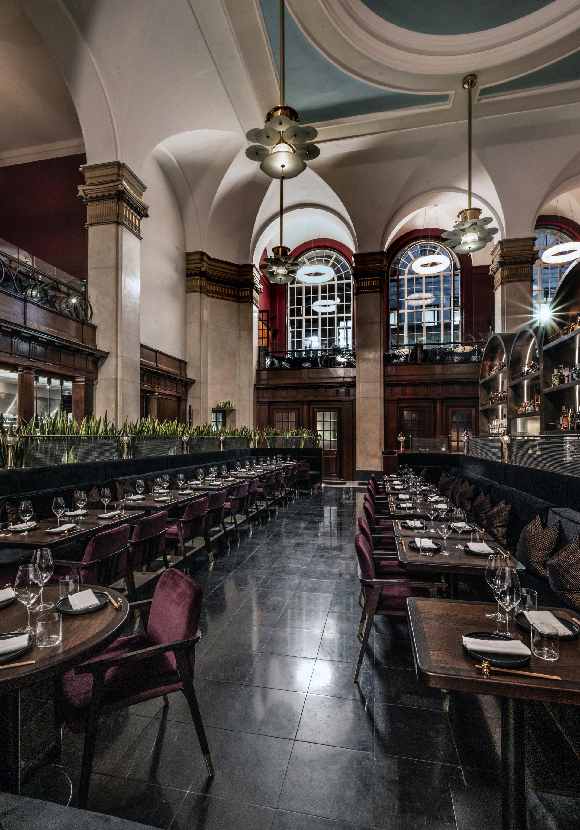 Elegant interior of Gordon Ramsay's Lucky Cat, showcasing Art Deco design and Japanese-inspired decor with table settings.