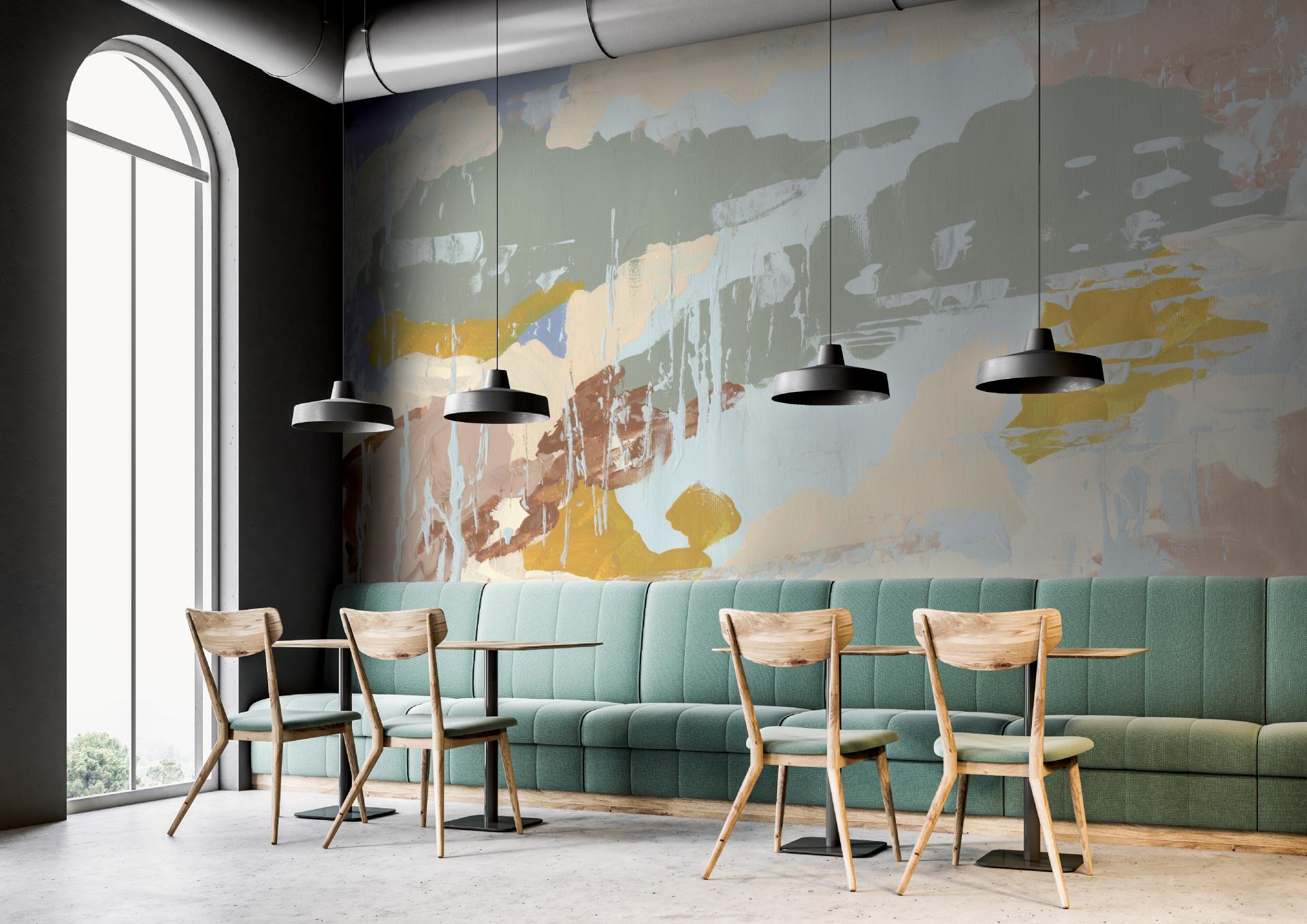 Stylish interior featuring a Jan Erika mural, organic shapes, and vibrant colors in a contemporary cafe setting.