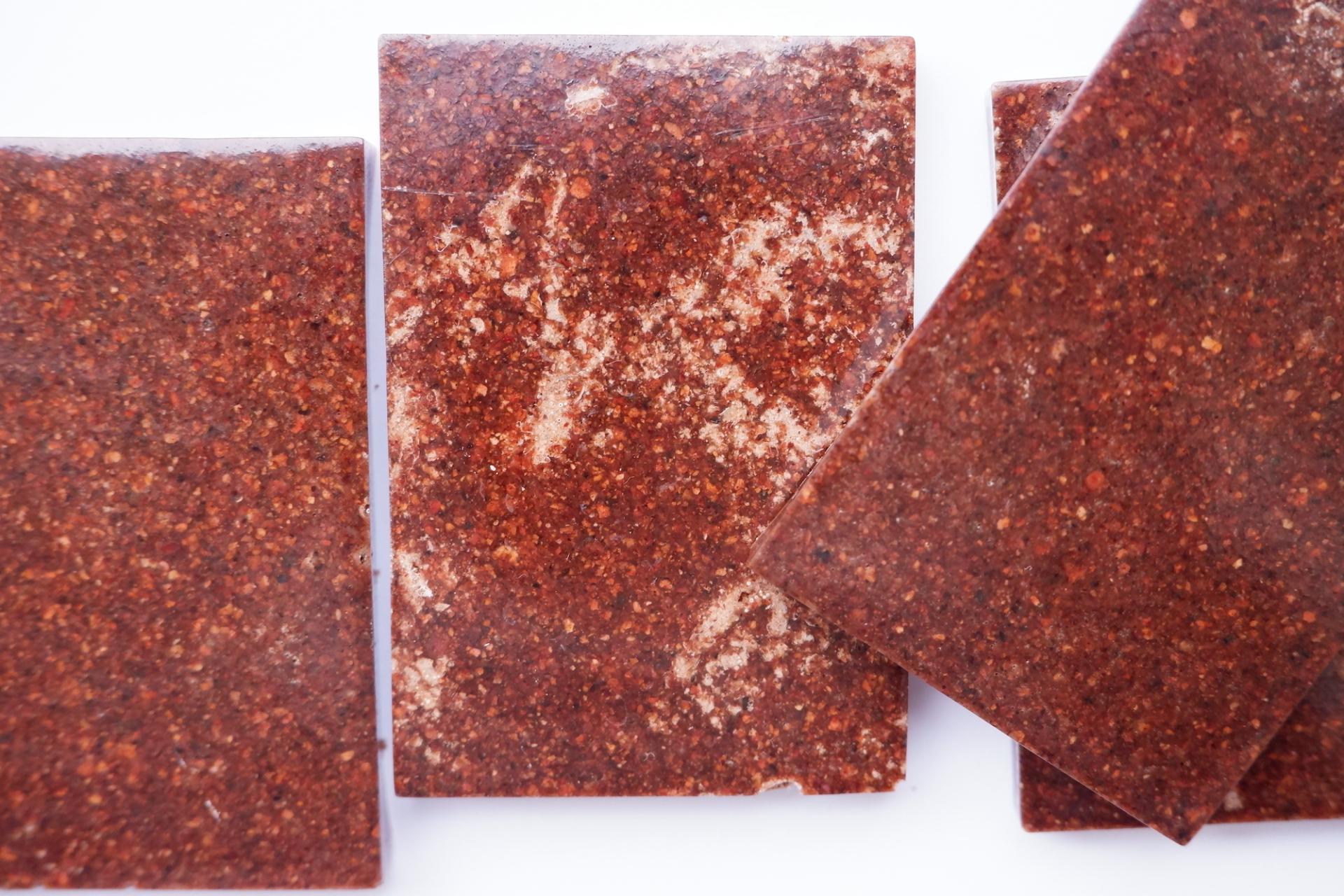 Biodegradable biomaterials samples showcasing earthy textures, highlighting innovations in circular economy and sustainable design.