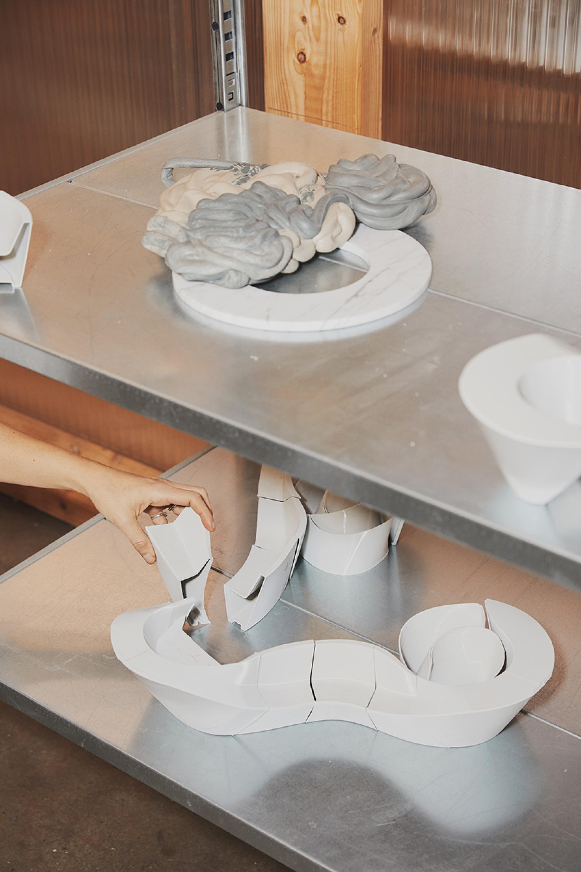 Multifunctional entrance furniture by The New Raw, showcasing innovative design elements in a creative workspace.