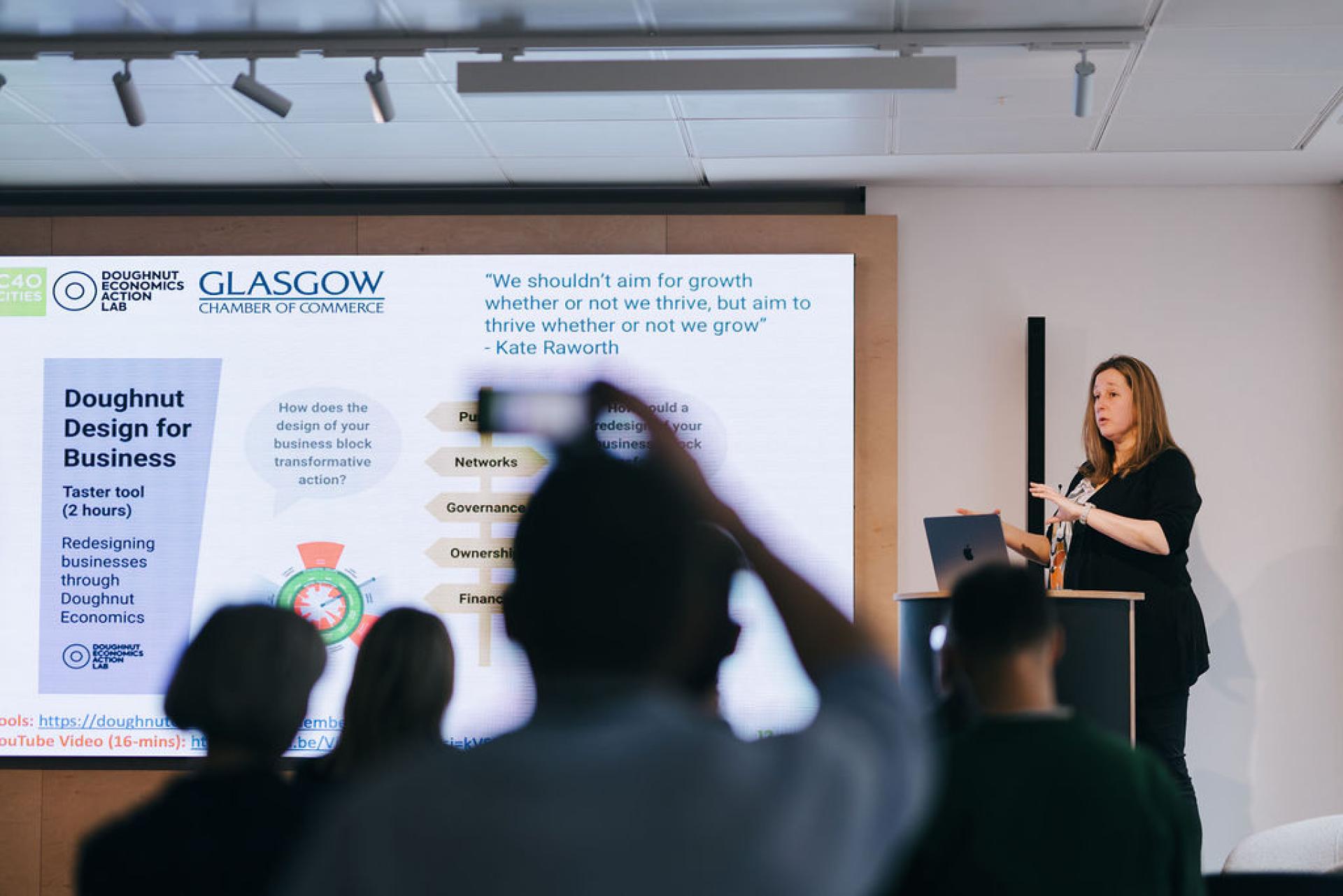 Professor Jaime Toney presenting on sustainable business practices at the Doughnut Economics workshop in Glasgow.