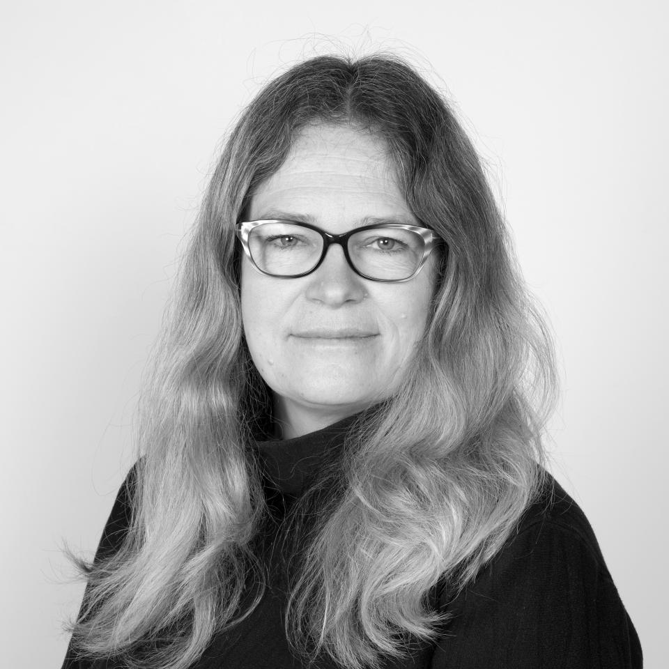 Pippa Nissen of Nissen Richards Studio, a London-based design studio, with long hair and black turtleneck.