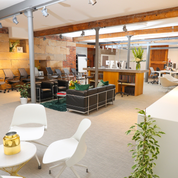 Modern Manchester showroom featuring ergonomic office furniture, seating areas, and a vibrant design aesthetic by Humanscale.