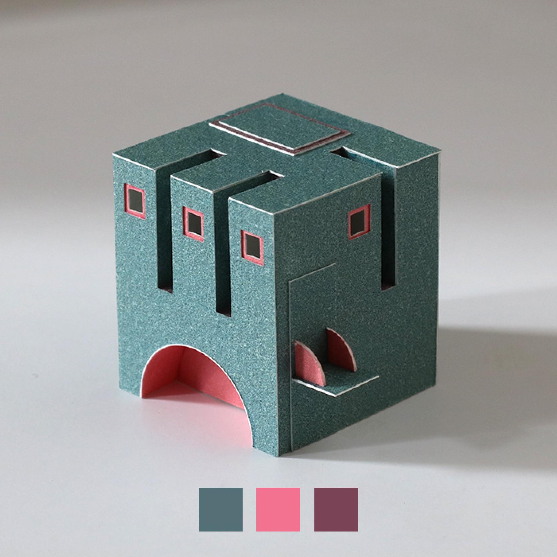 Miniature paper model of an architectural structure by Charles Young, featuring intricate details and vibrant colors.