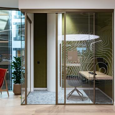 Radii supports tp bennett & Overbury with bespoke bronze framed glazed partitions at banking HQ in London.