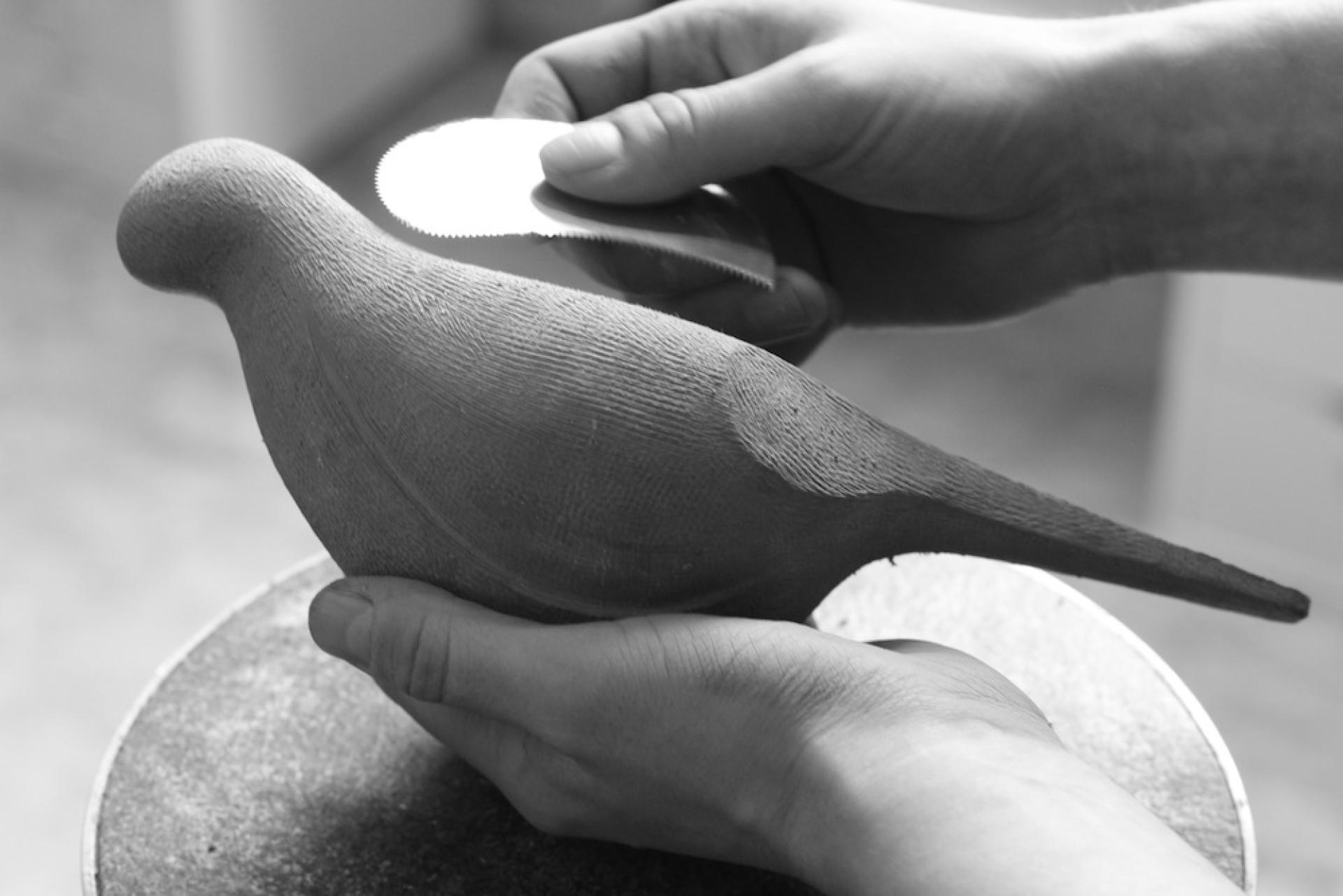 Crafting a wooden bird sculpture during a creative workshop at Material Source Studio in Manchester.