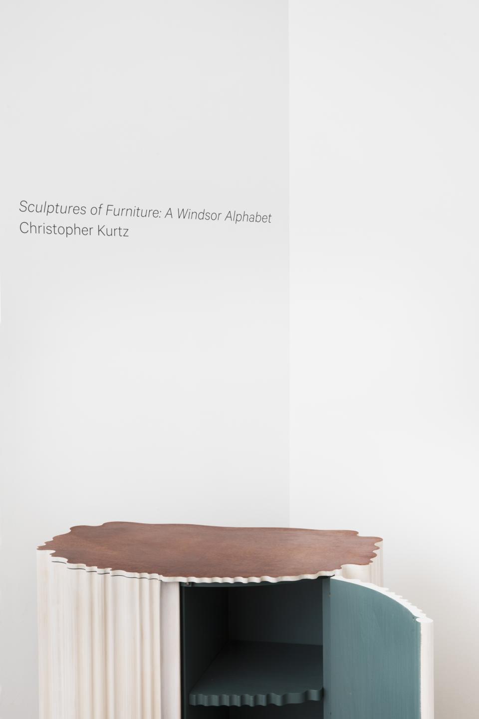 Windsor chair-inspired sculpture by Christopher Kurtz, showcasing unique materials and creative design elements in modern furniture art.