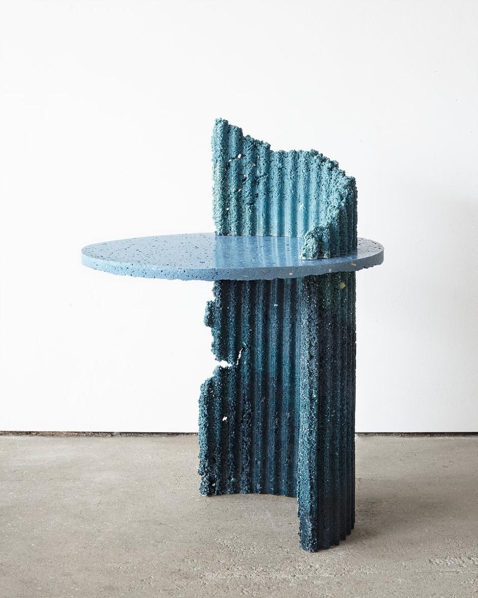Sustainable design piece featuring a unique blue table made from recycled materials, reflecting ecological innovation at London Design Festival 2018.