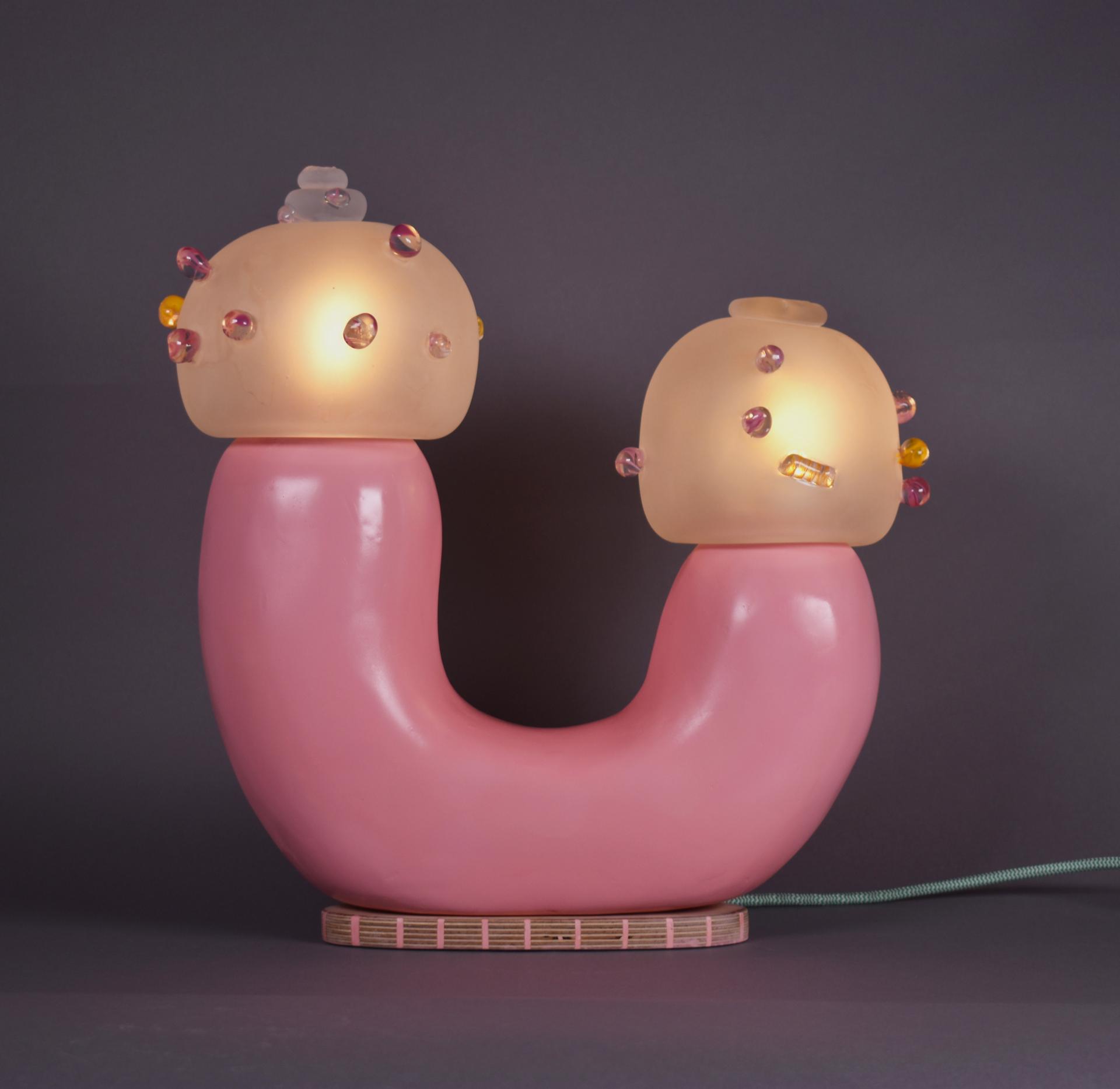 Playful pink lamp with decorative frosted glass shades, featured in the Graduate Design Shows 2023.