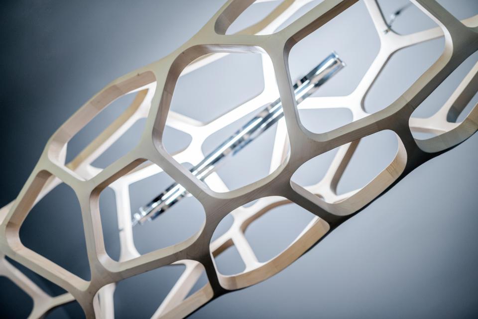 Parametric design light fixture made of natural wood enhances the contemporary interior of Textúra restaurant.