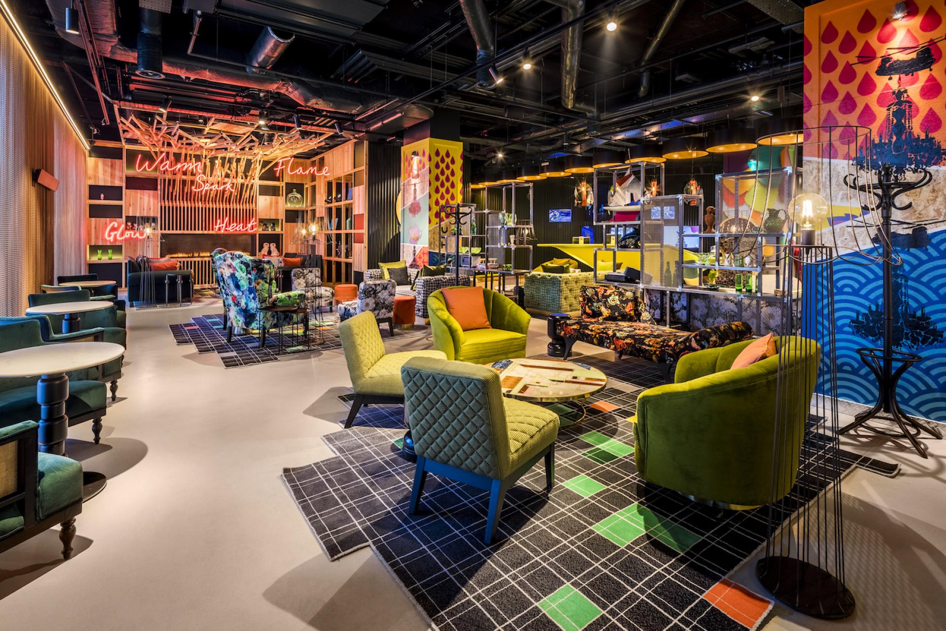Vibrant lounge area in nhow London, featuring eclectic furniture and artistic decor that reflect Shoreditch's creative vibe.