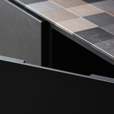 Sustainable PaperStone surface material showcased on a modern kitchen countertop with contrasting textured colors.