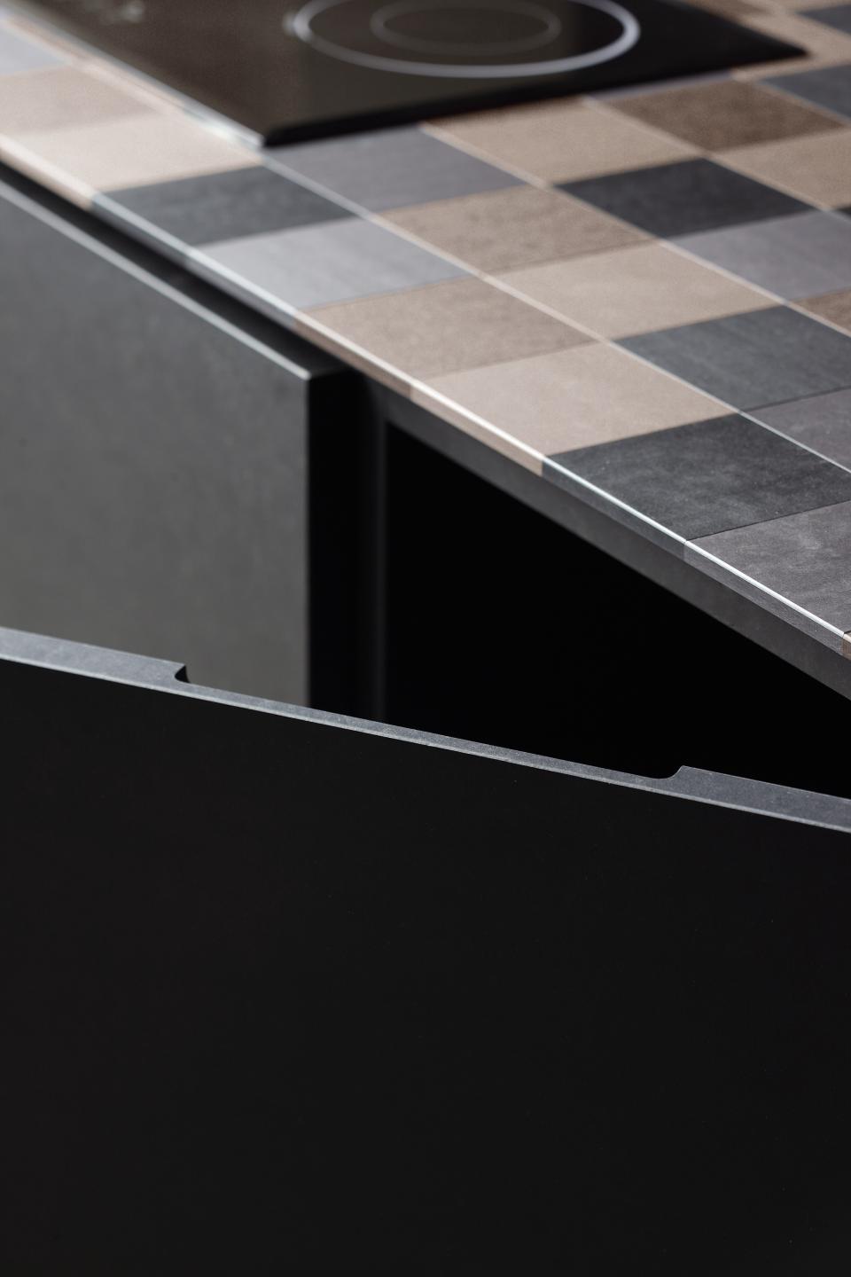 Sustainable PaperStone surface material showcased on a modern kitchen countertop with contrasting textured colors.