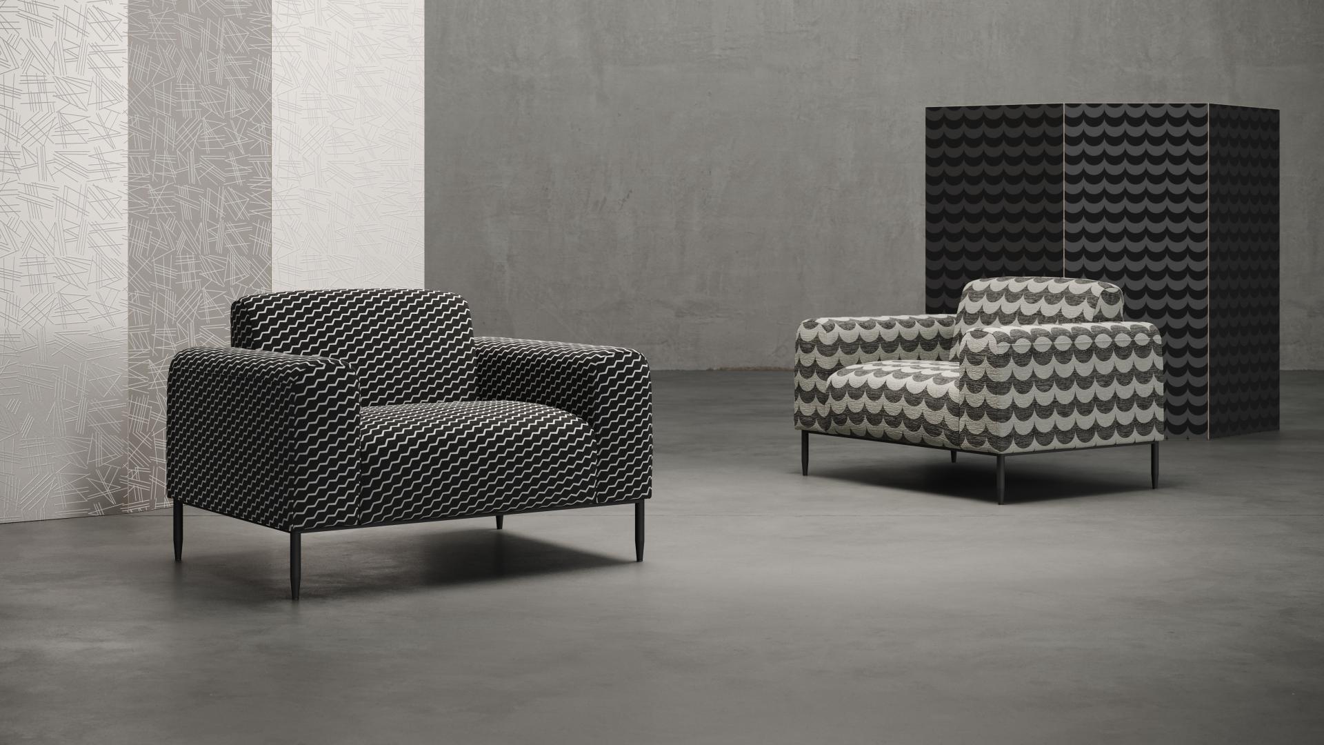 Modern Flock collaboration features two stylish armchairs with unique patterned upholstery against a minimalist backdrop.