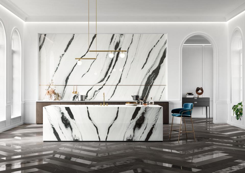 Contemporary kitchen with striking marble countertops and geometric design elements, showcasing 2019 CERSAIE interior design trends.