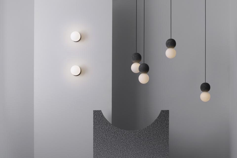 Modern Origo lighting collection by Studio davidpompa, featuring geometric designs with volcanic rock and glass elements.