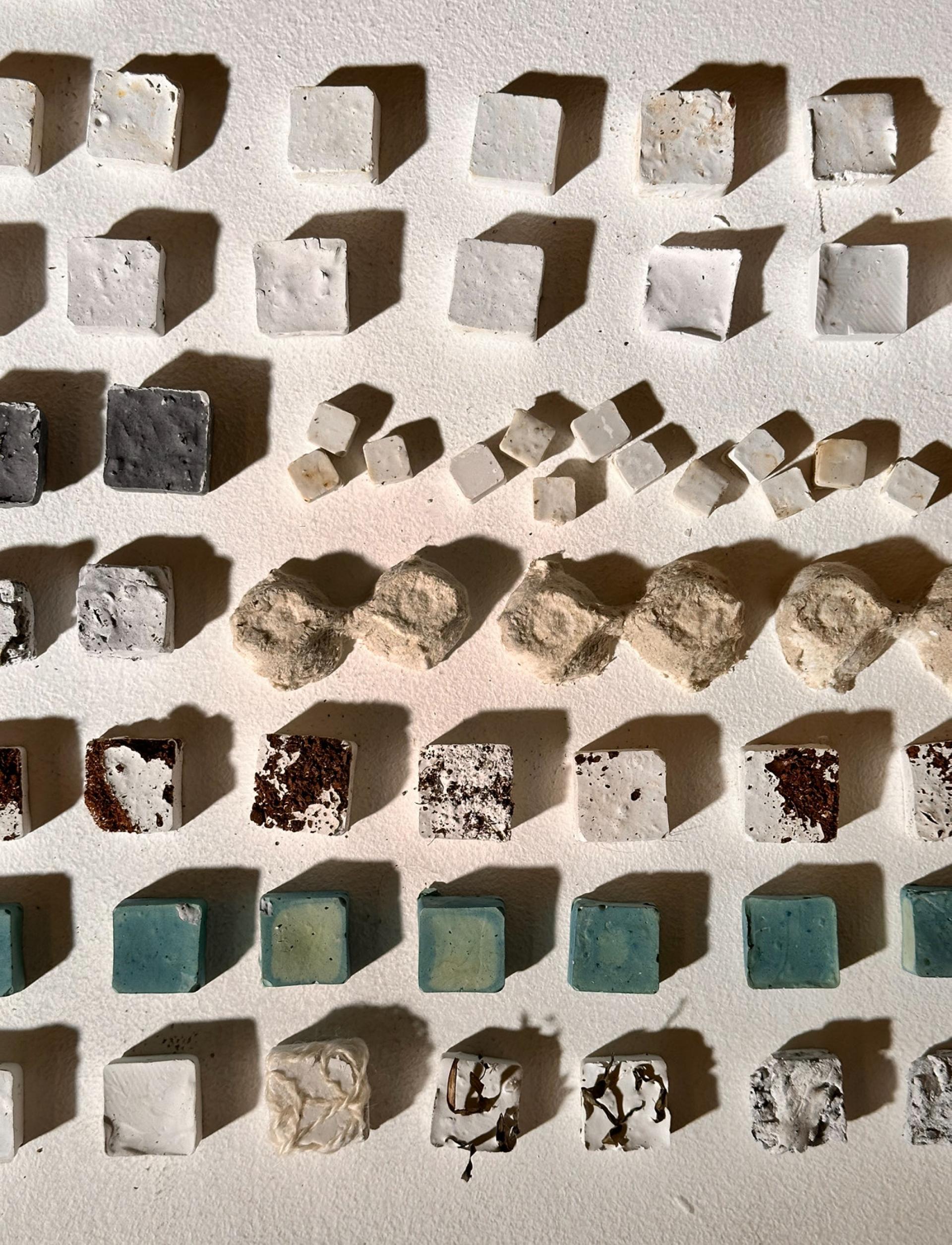 Colorful material samples arranged in a grid, showcasing textures and variations from New Designers 2024 event.