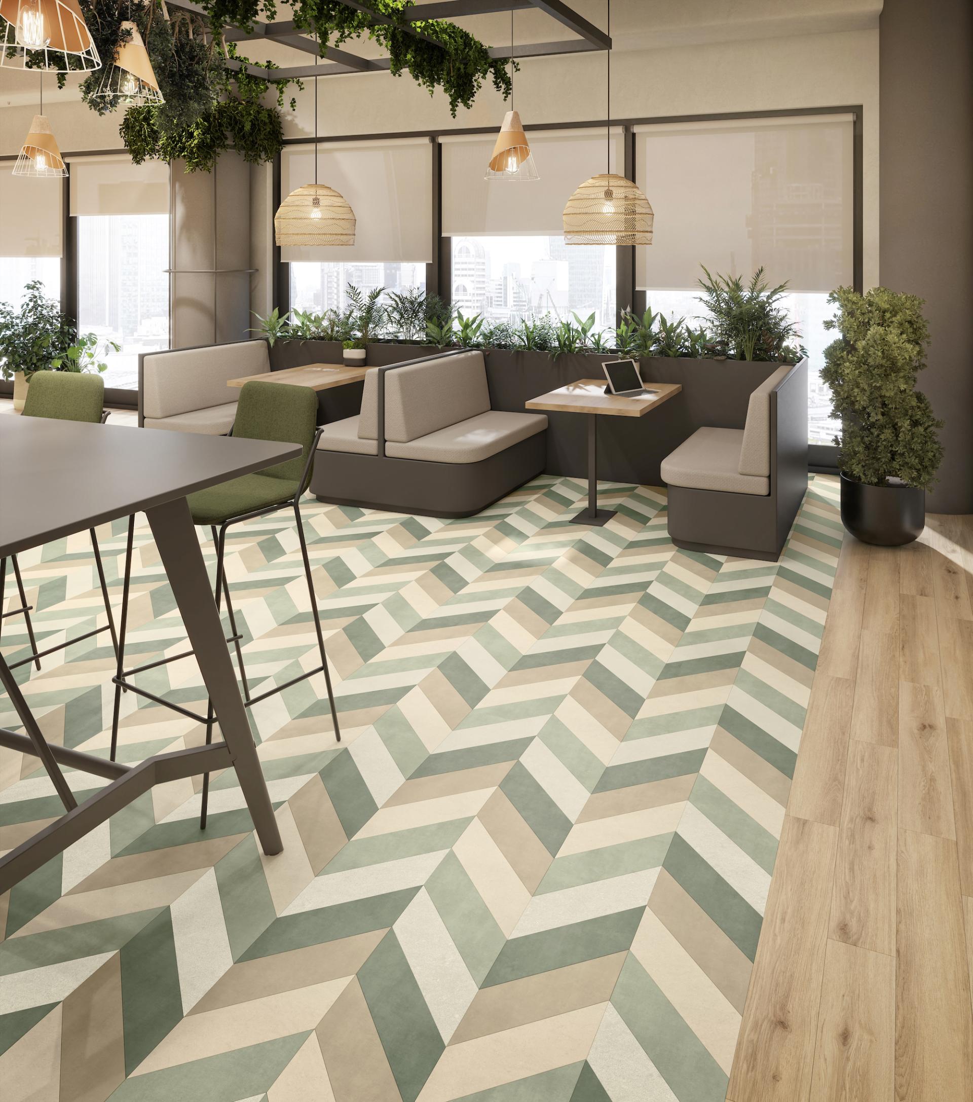 Stylish commercial space featuring a chevron-patterned floor and greenery, promoting indoor-outdoor design and wellbeing.