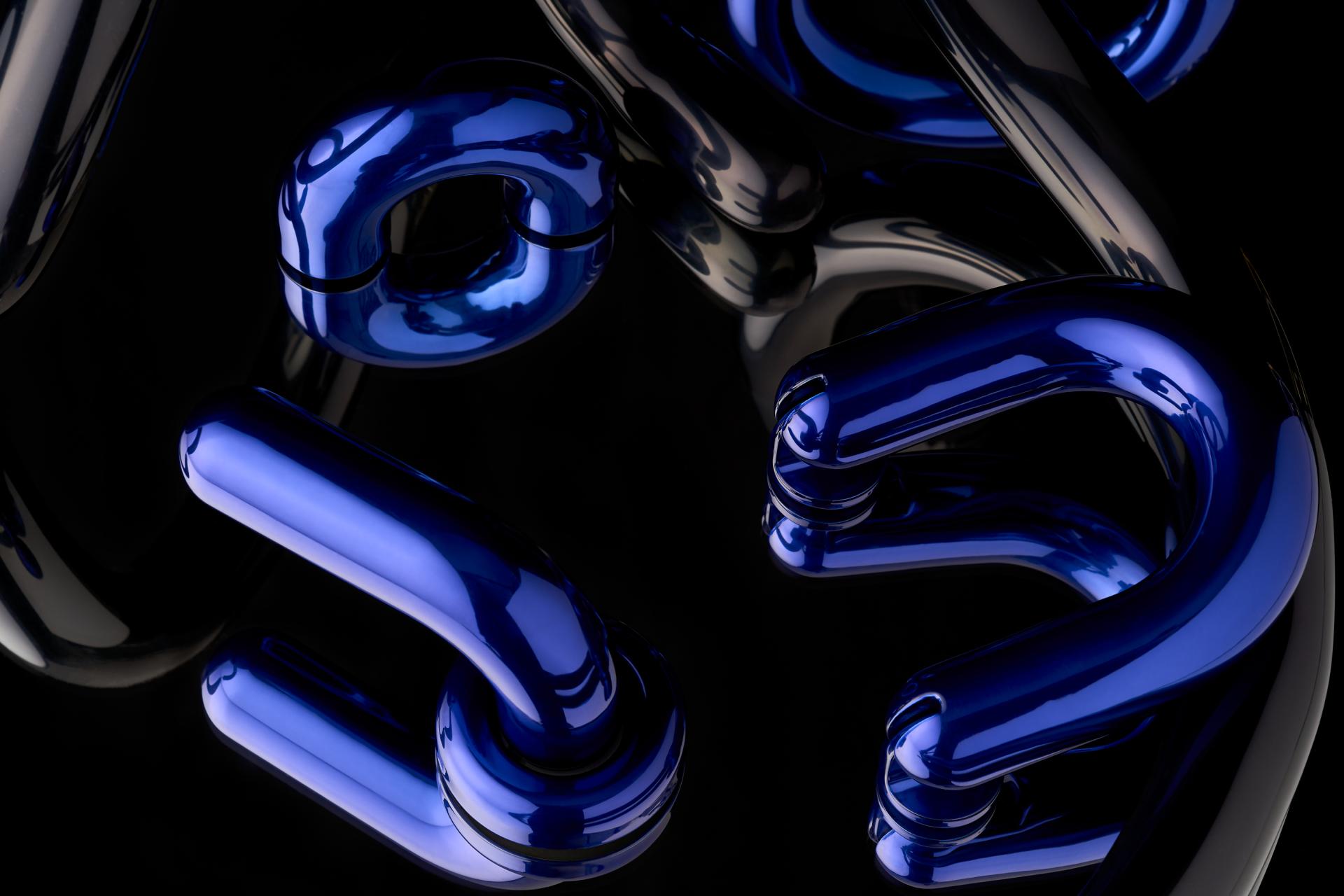 Abstract blue and black sculptural forms emphasize modern design aesthetics in the Material Source Studio.