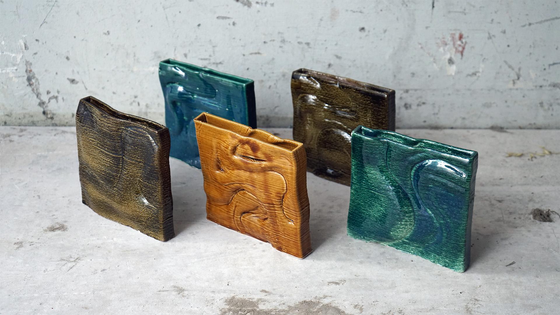 Colorful, textured biomaterial samples displayed on a surface, showcasing innovative designs for sustainable products in 2025.